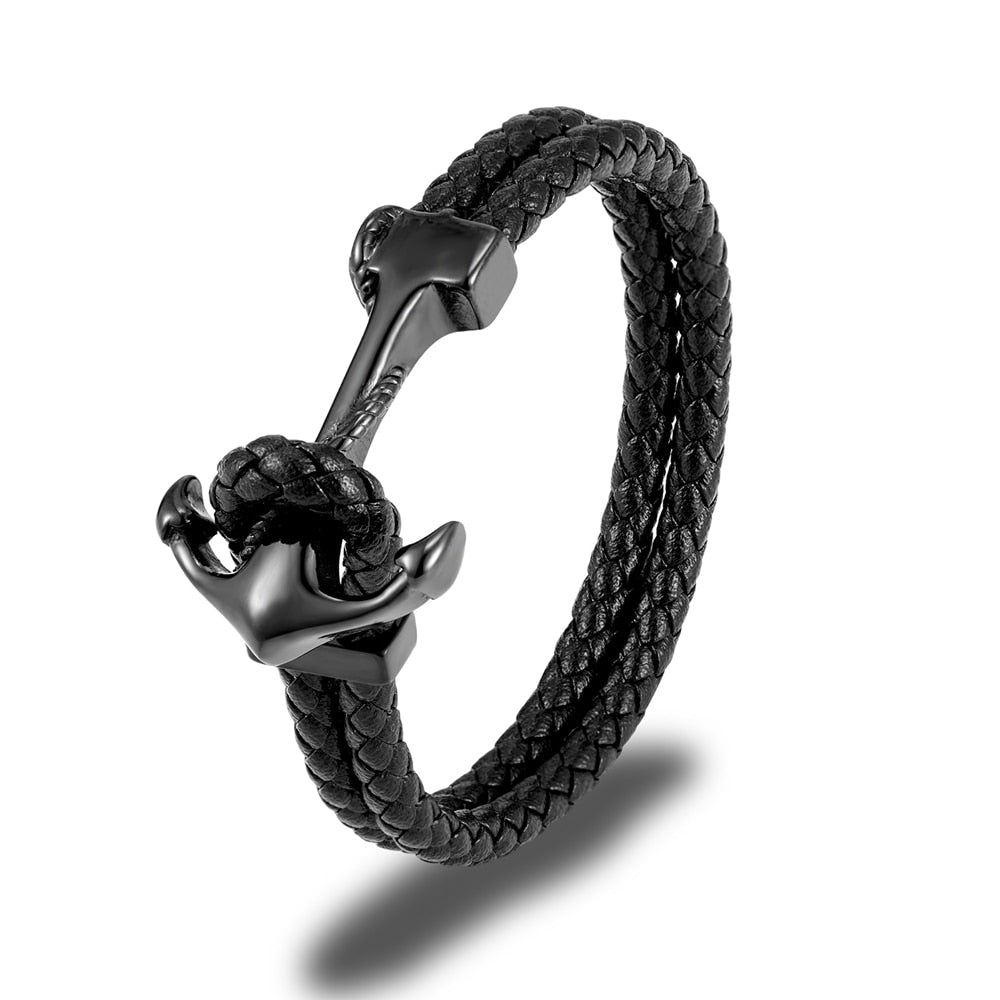 Ce bracelet, tressé de cuir et orné d'une ancre dorée, incarne l'esprit aventureux et intemporel du marin en quête de trésors