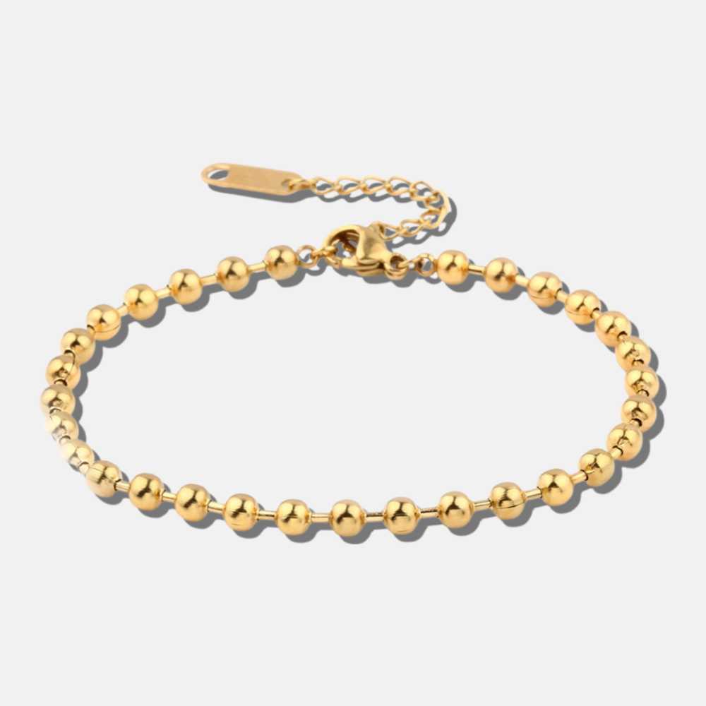 Ce bracelet scintille comme un filon d'or caché sous les vagues, brillant d'une élégance qui ferait jalouser les plus beaux trésors des mers